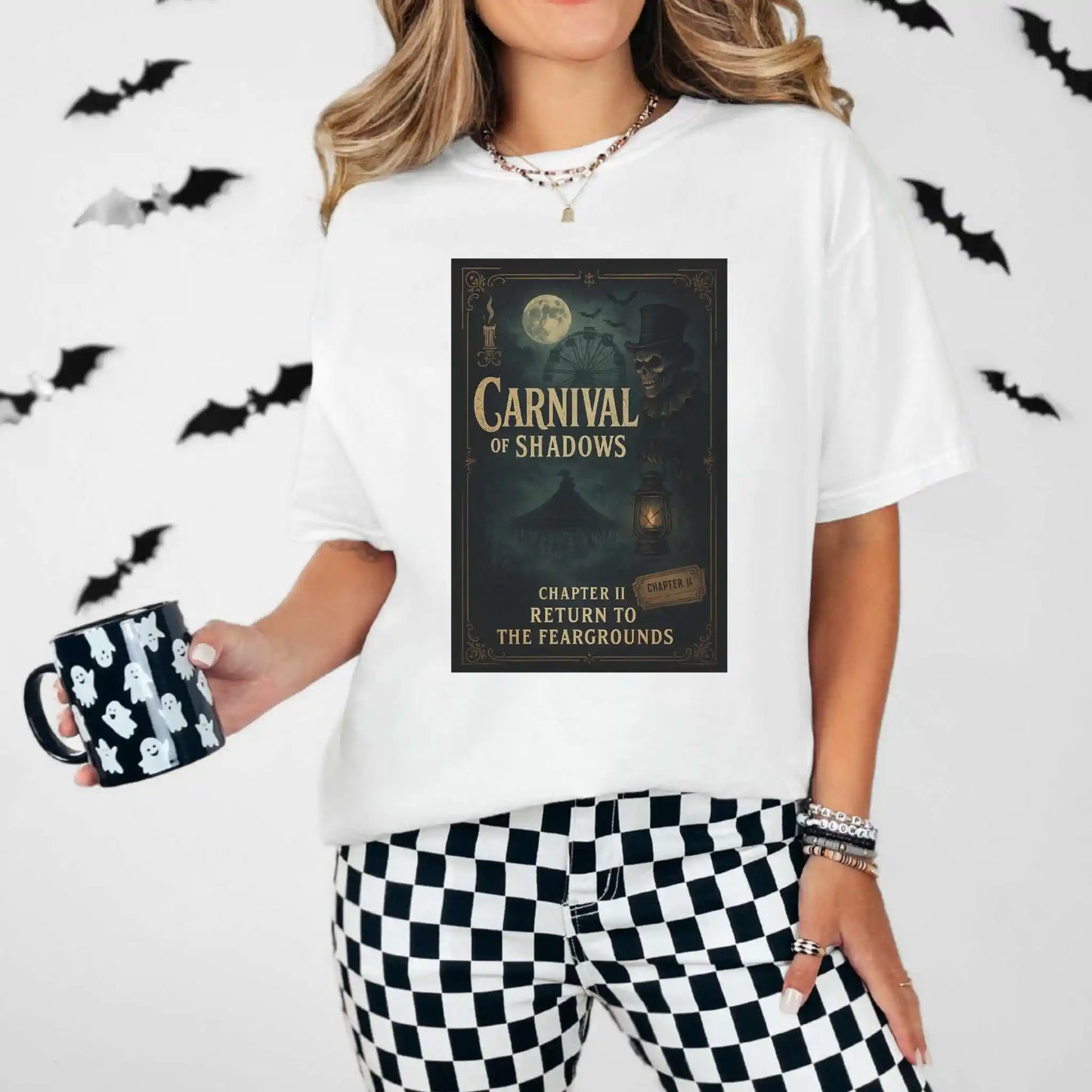 Person wearing a white t-shirt with 'Carnival of Shadows' design, holding a mug with bat design, against a Halloween-themed background.