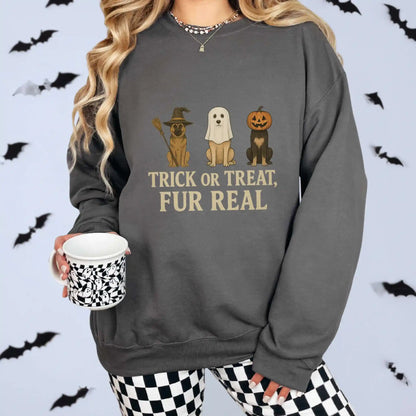 Woman wearing a charcoal Halloween-themed sweatshirt with cartoon dogs and "trick or tread, fur real" text, holding a cup with a checkered design.
