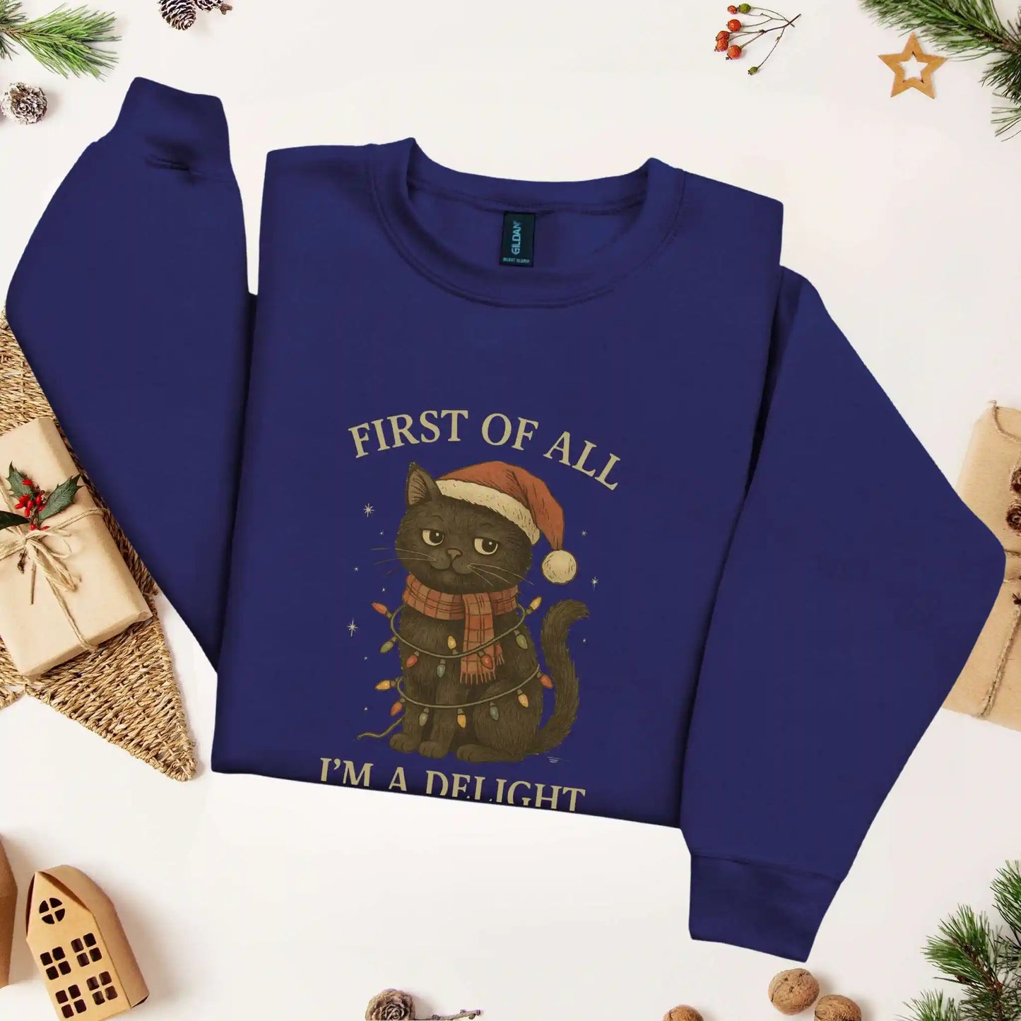 Navy sweatshirt with a cat wearing a Santa hat and Christmas lights, surrounded by festive decorations.